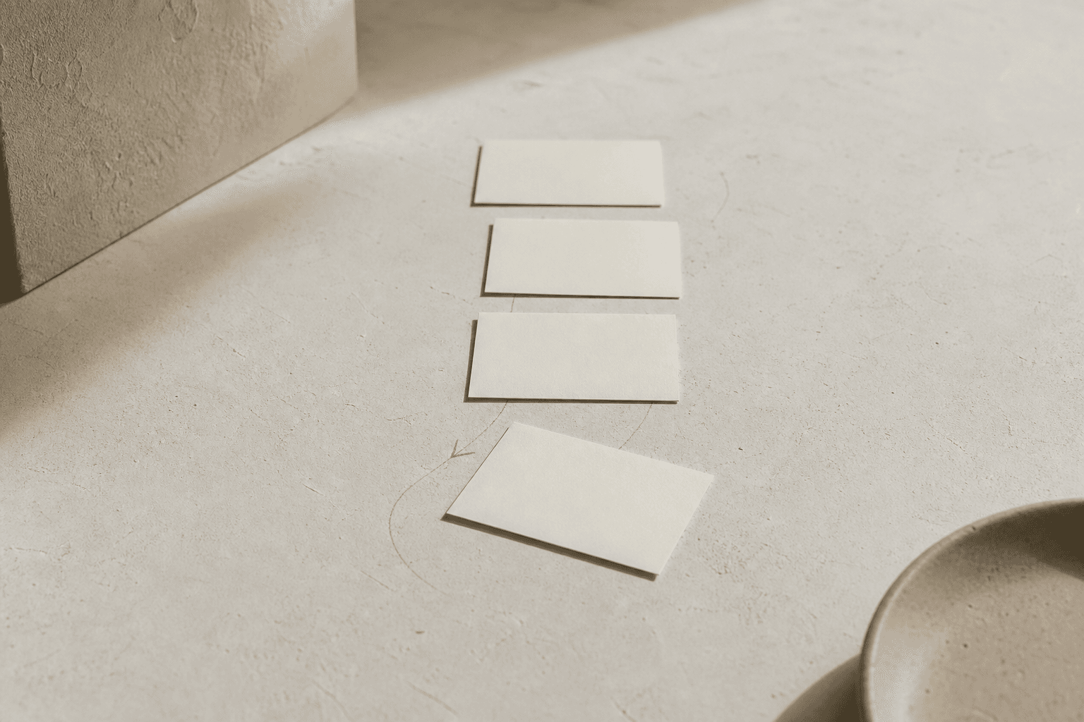 Blank cards arranged as a conversation path for an article about prompt design in conversational AI