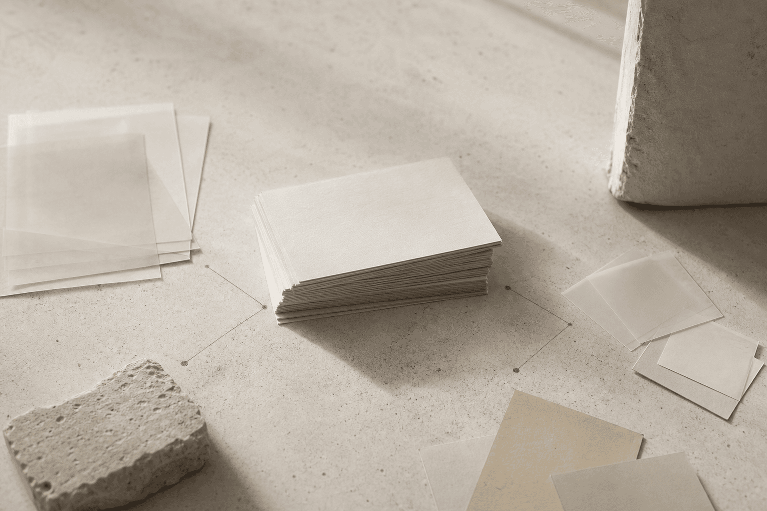Layered paper cards and faint connecting marks for an article about semantic layers over LLM APIs